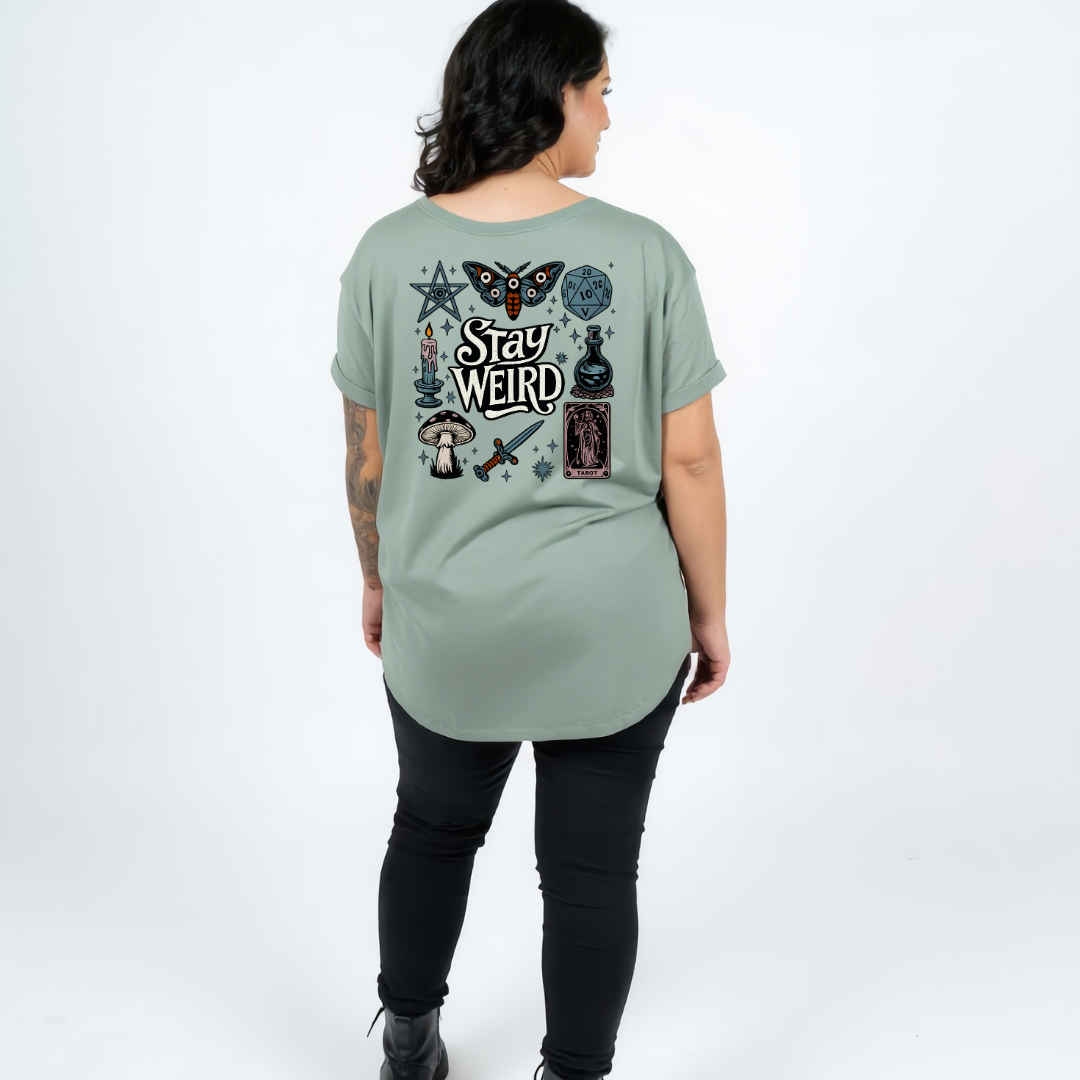 Woman wearing slate green oversized graphic tee with Stay Weird witchy illustration back print, plus size Australian streetwear by Bae Bands