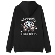A black pullover hoodie shown from the back, featuring a graphic print of two tattooed hands holding a silver orb with the text 'SUMMONING A FUCK TO GIVE' in white.