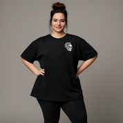Front view of woman wearing black My Tattoos Don't Like You Either oversized tee, relaxed drop shoulder fit, plus size Australian streetwear by Bae Bands