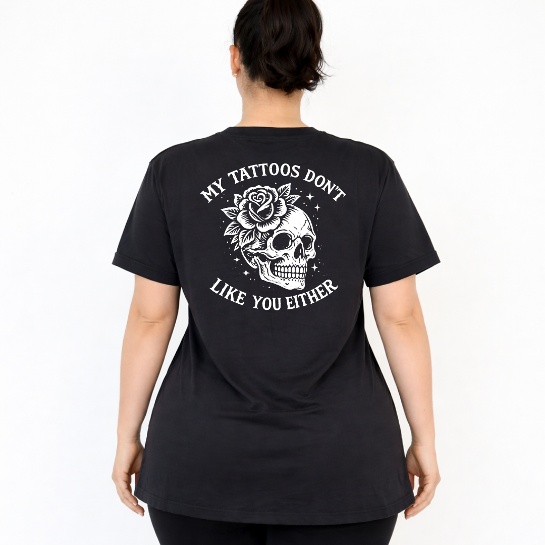Back view of black My Tattoos Don't Like You Either v neck tee showing full skull and rose DTF print with arched text detail, Bae Bands Australia