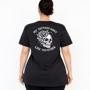Back view of black My Tattoos Don't Like You Either v neck tee showing full skull and rose DTF print with arched text detail, Bae Bands Australia
