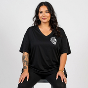 Front view of woman wearing black My Tattoos Don't Like You Either v neck tee, relaxed fit, plus size Australian streetwear by Bae Bands