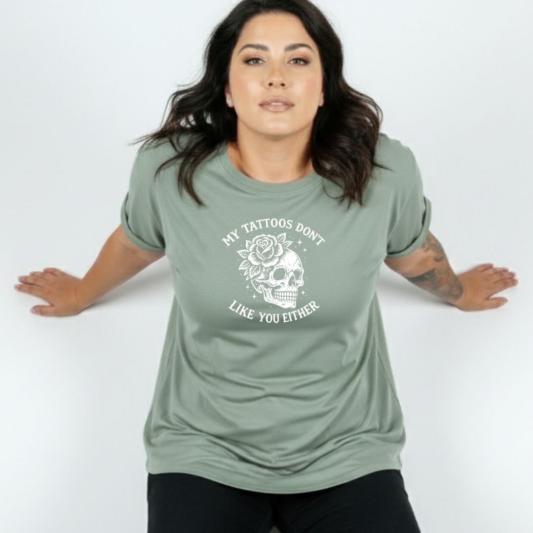 Front view of woman wearing teal My Tattoos Don't Like You Either oversized tee, relaxed drop shoulder fit, plus size Australian made streetwear by Bae Bands