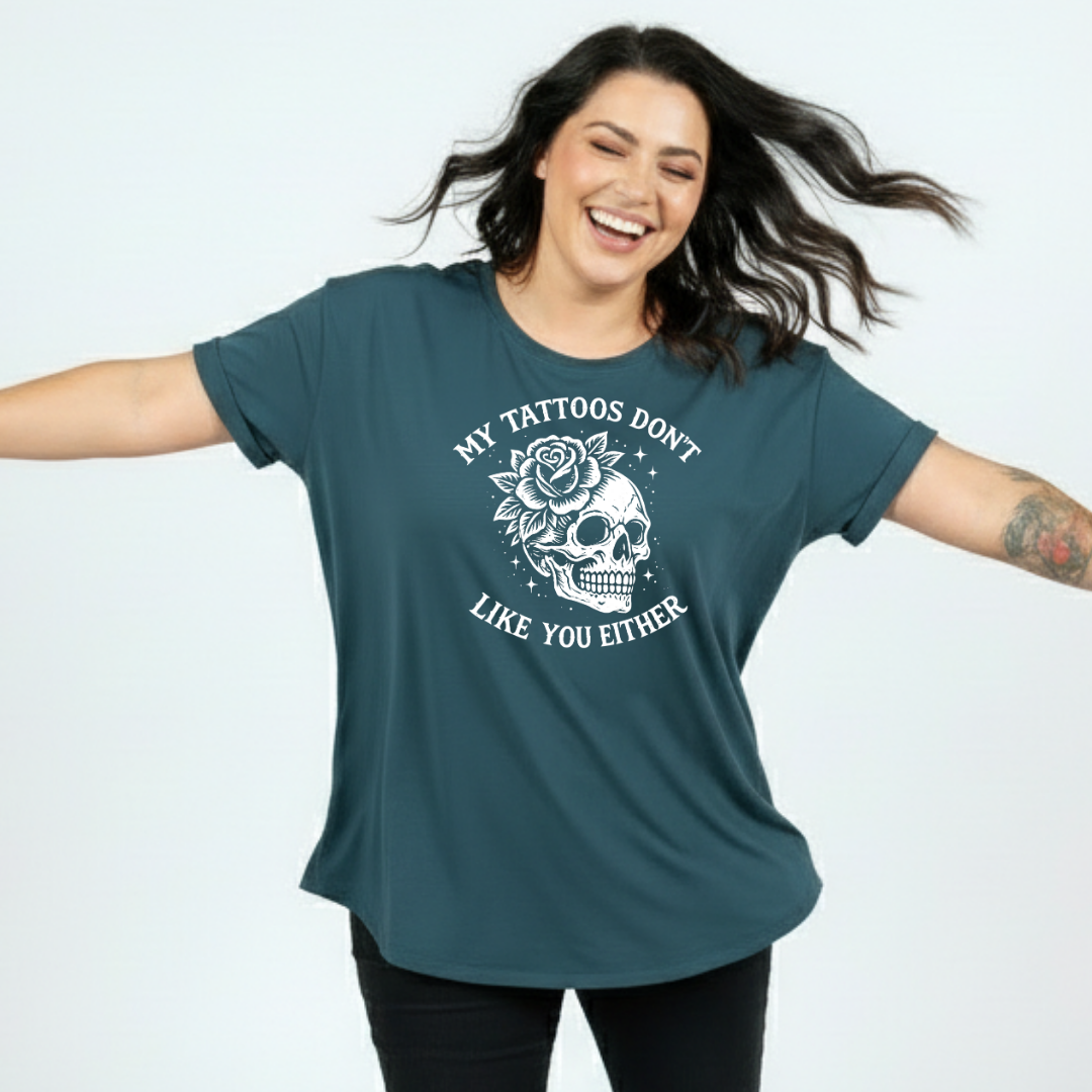 Front view of woman wearing slate green My Tattoos Don't Like You Either oversized tee, relaxed drop shoulder fit, plus size Australian streetwear by Bae Bands
