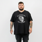 A man wearing black v neck graphic tee with My Tattoos Don't Like You Either skull and rose back print, plus size Australian streetwear by Bae Bands