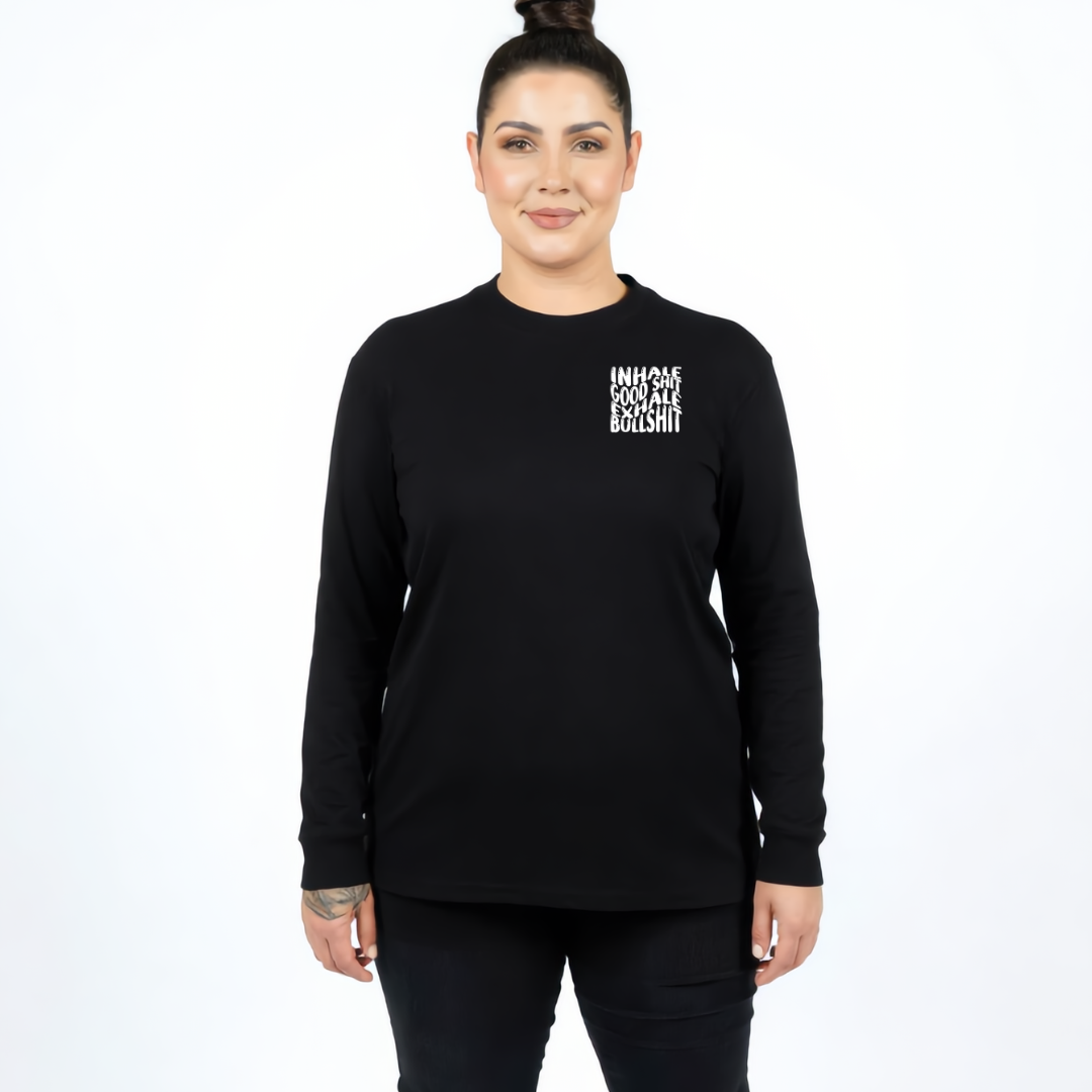 Woman wearing black long sleeve graphic tee with Inhale Good Shit Exhale Bullshit bold stacked white text DTF print, plus size Australian streetwear by Bae Ban