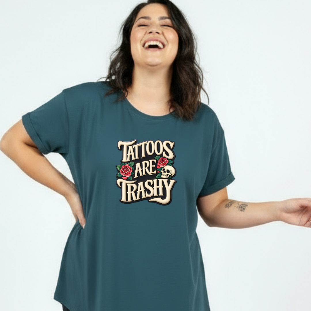 Woman wearing a teal t-shirt with 'Tattoos Are Trashy' text on a white background