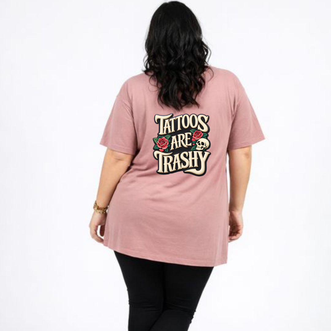 Person wearing a pink t-shirt with 'Tattoos Are Trashy' text on the back.