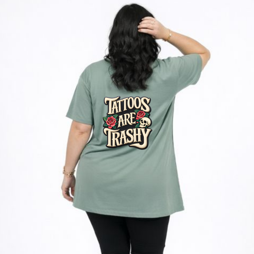 Person wearing a green t-shirt with 'Tattoos Are Trashy' text and roses on the back.