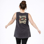 Person wearing a sleeveless shirt with 'Tattoos Are Trashy' text on the back.
