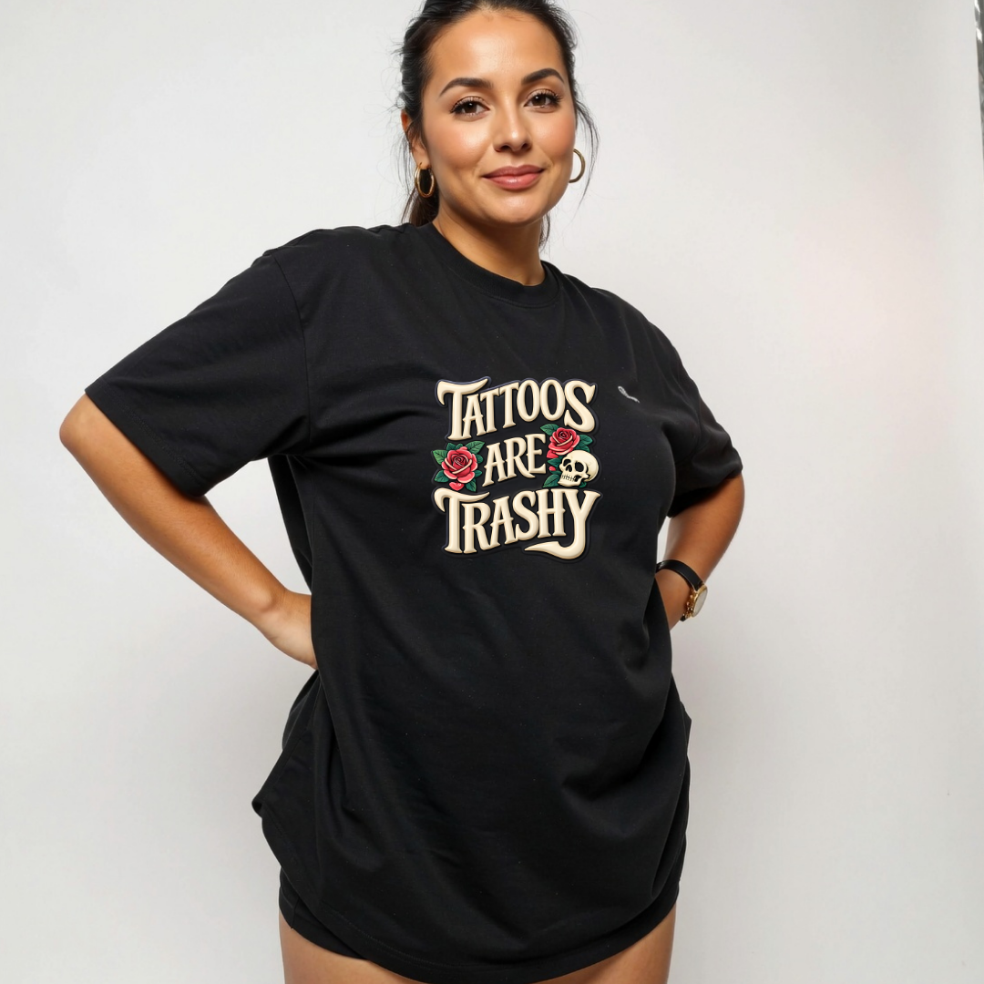 Person wearing a black t-shirt with 'Tattoos Are Trashy' text and roses on a plain background