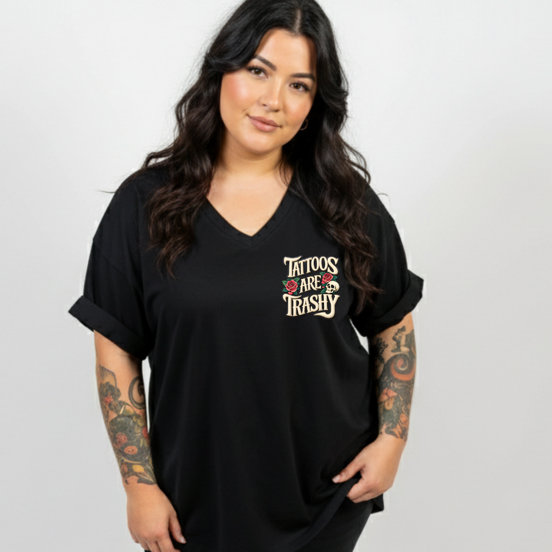 Woman wearing a black t-shirt with 'Tattoos Are Trashy' text on a plain background