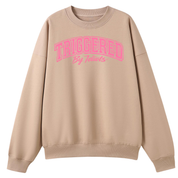 A beige crewneck sweatshirt with a pink graphic text print reading 'TRIGGERED By Teachers' on the chest, displayed against a solid white background.