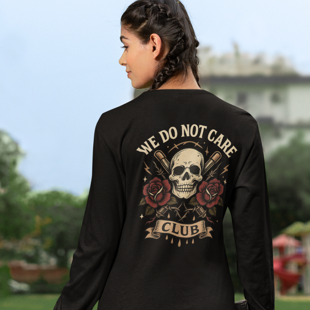 Plus-size black long sleeve tee with cream “We Do Not Care Club” text above dripping skull, rose and barbed wire graphic – handmade Melbourne streetwear by Bae Streetwear