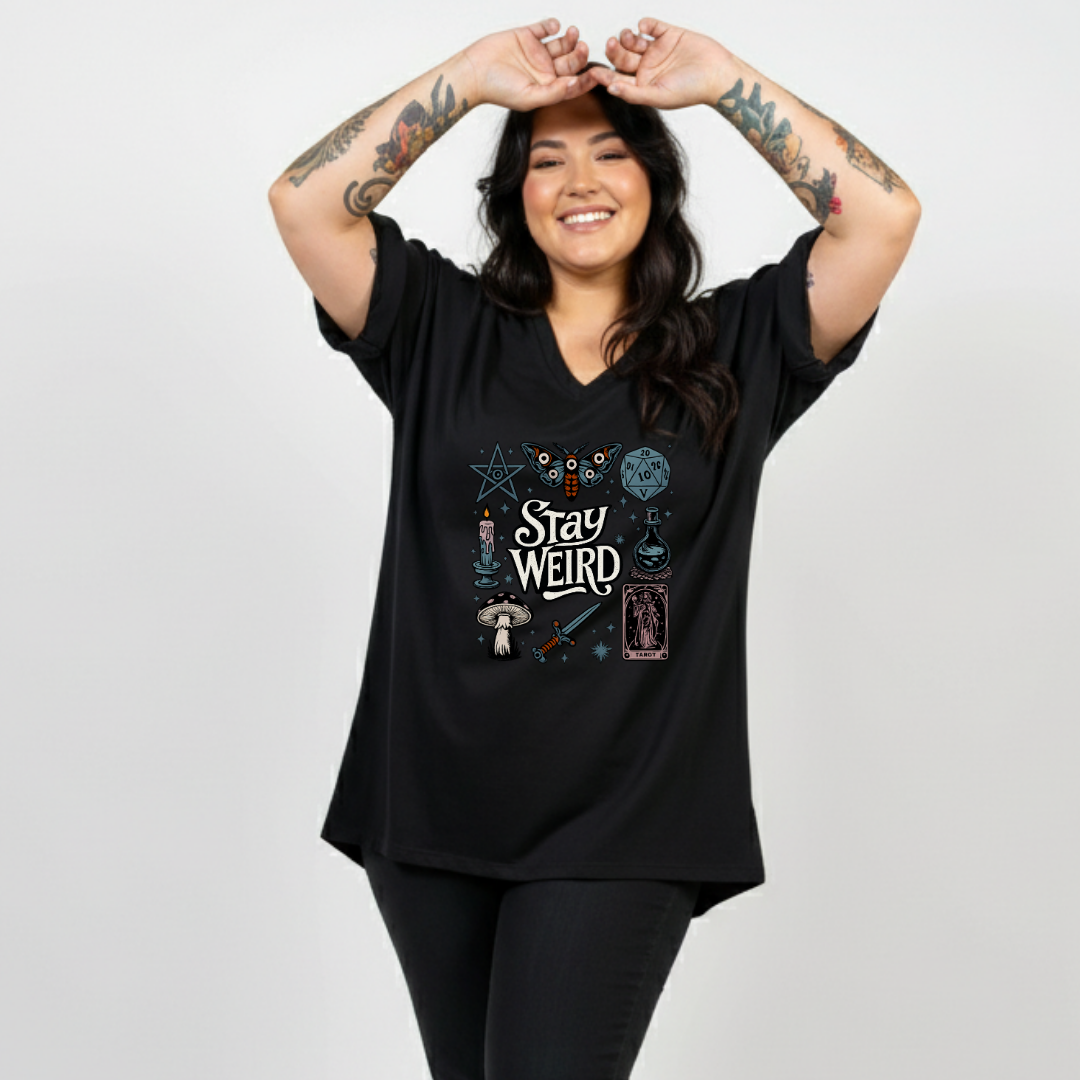 Front view of woman wearing black Stay Weird v neck tee, relaxed fit, plus size Australian streetwear by Bae Bands
