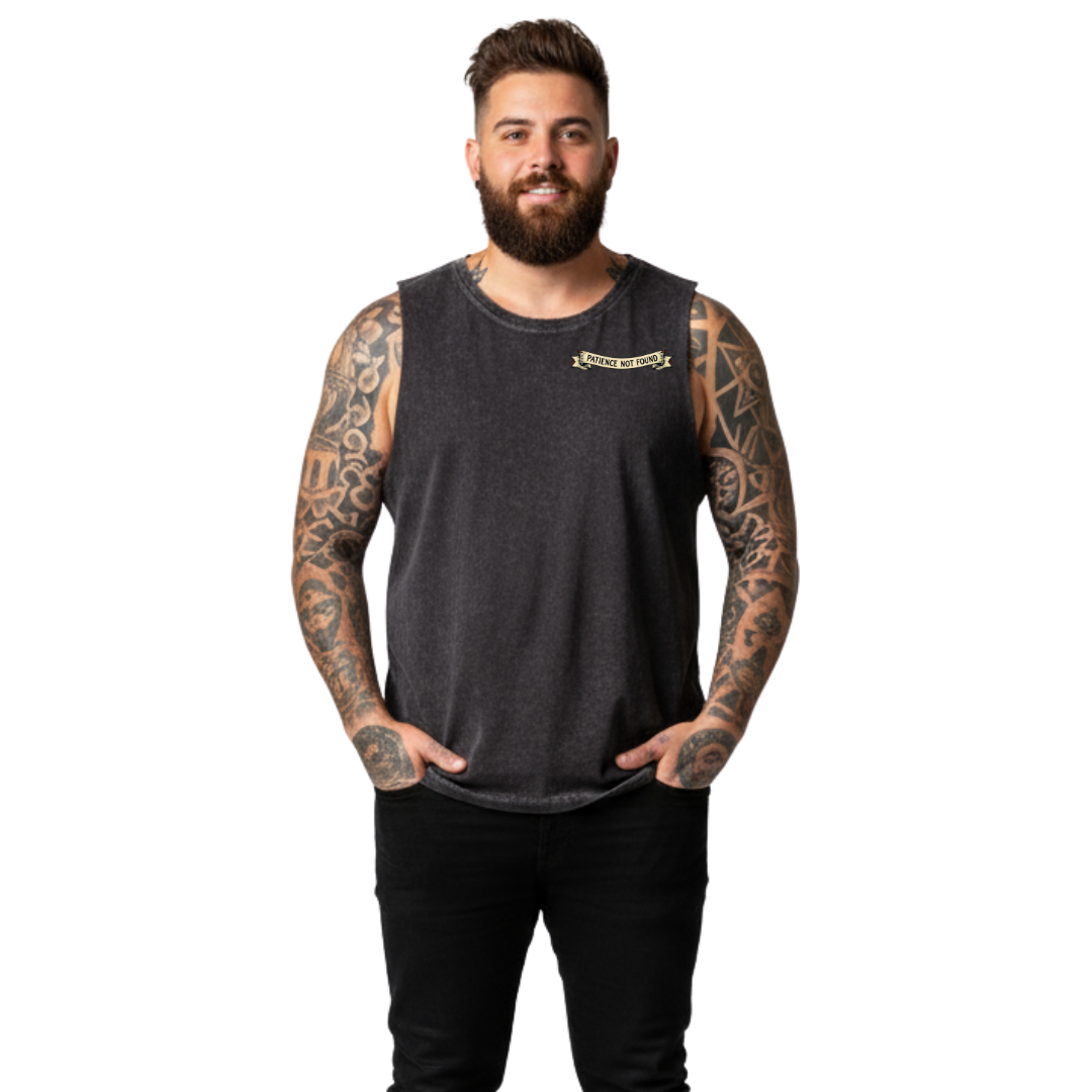 Front view of a man wearing black stonewashed Error 404 Patience Not Found tank top, relaxed fit, cyber skull graphic, plus size Australian streetwear by Bae Bands