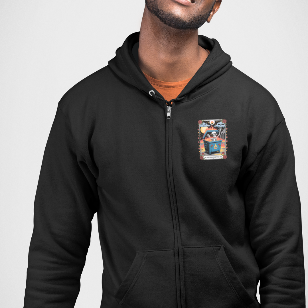 Person wearing a black hoodie with a colorful patch on the chest against a plain background