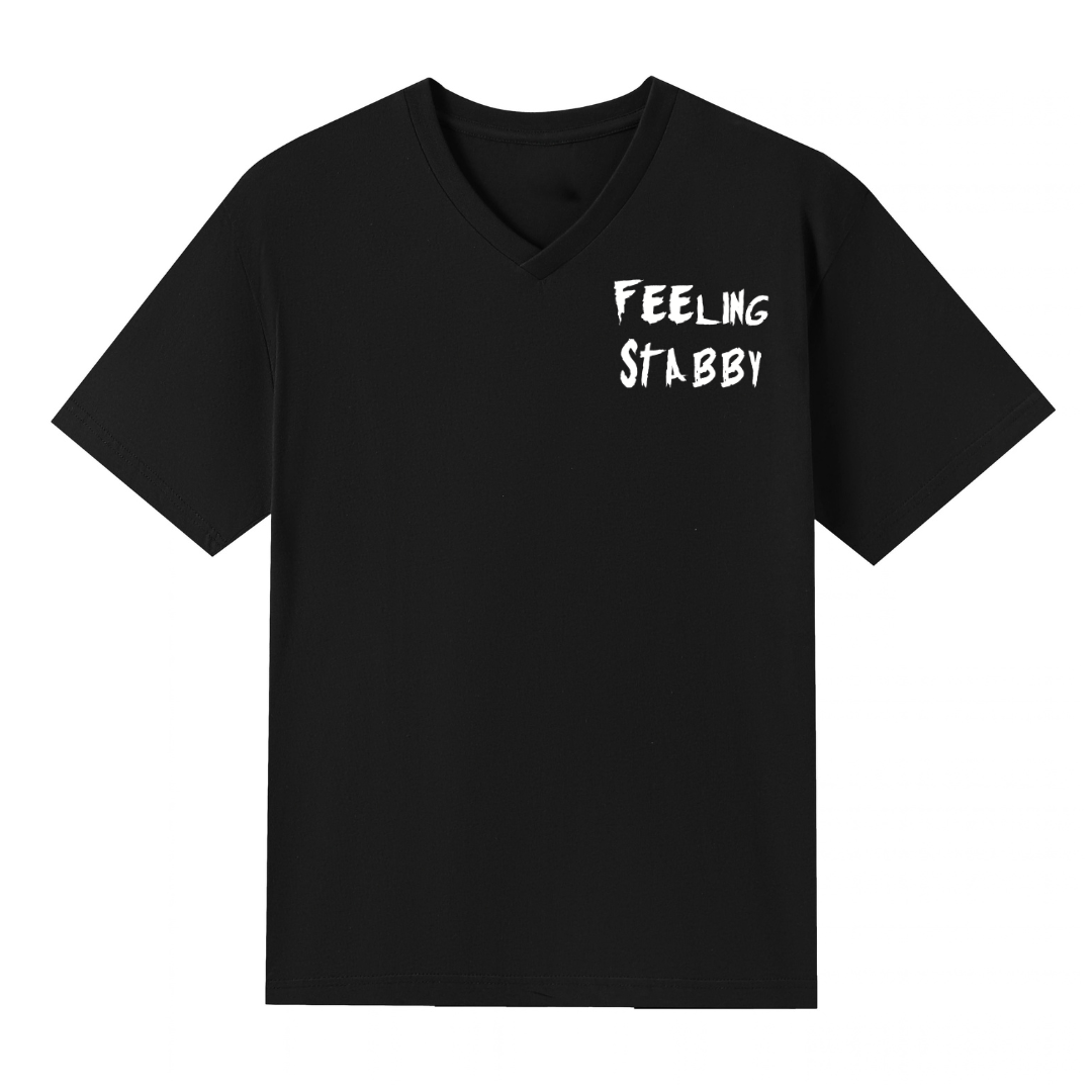 A black V neck oversized tee with a small Feeling Stabby graphic on the left chest.