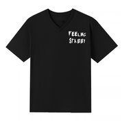 A black V neck oversized tee with a small Feeling Stabby graphic on the left chest.