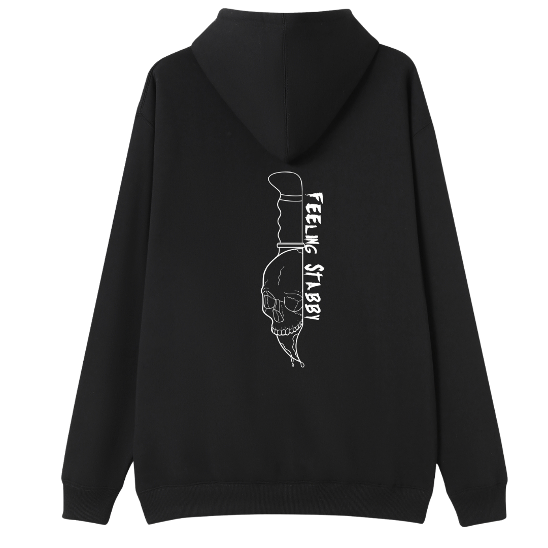 A black oversized zip up hoodie shown from the back, with the Feeling Stabby graphic printed large across the back, a line drawn skull on a knife blade.
