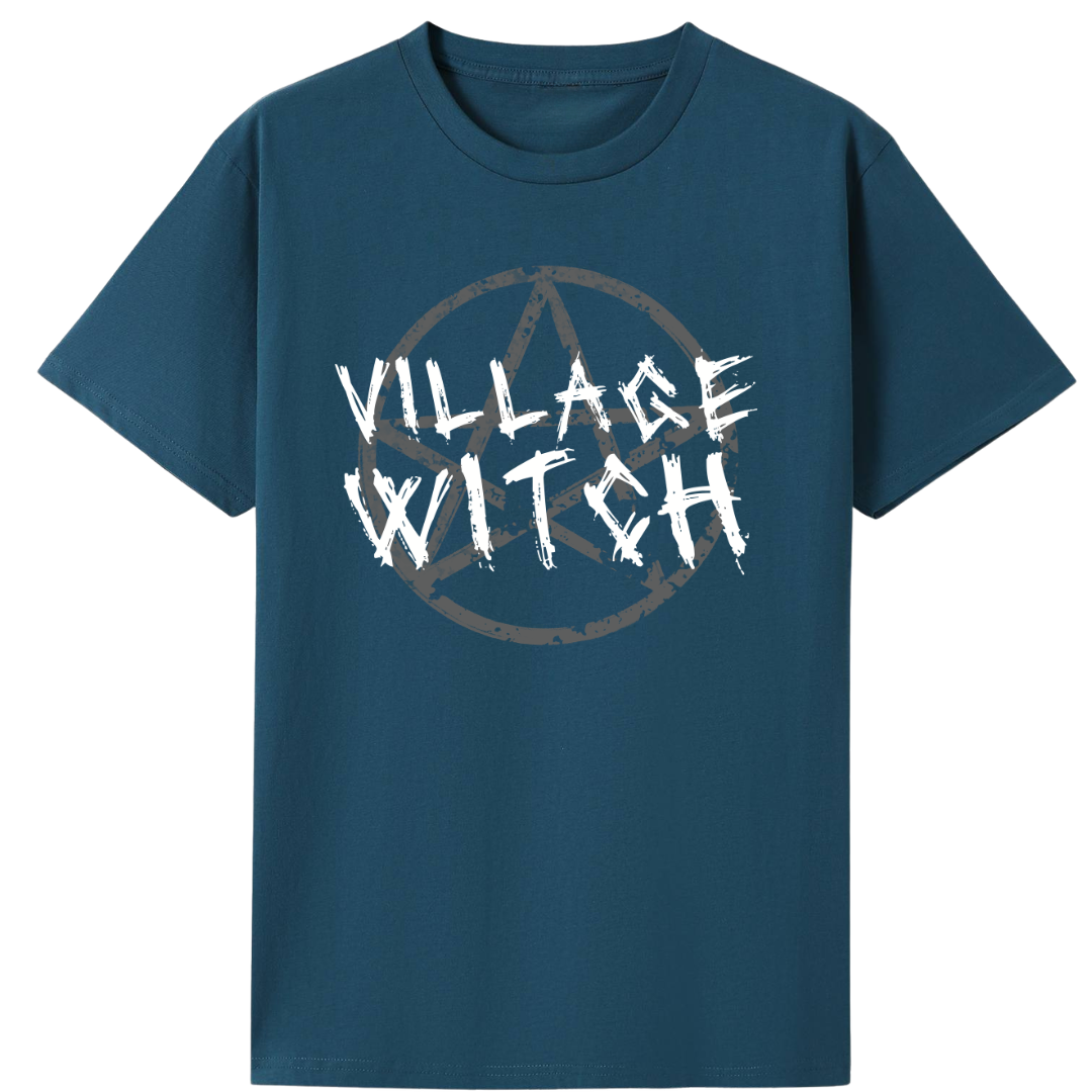 A teal oversized tee with the Village Witch graphic printed large on the front, scratchy lettering over a weathered pentagram.