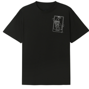 A black oversized tee with a small We'll Come Back Again graphic on the left chest.