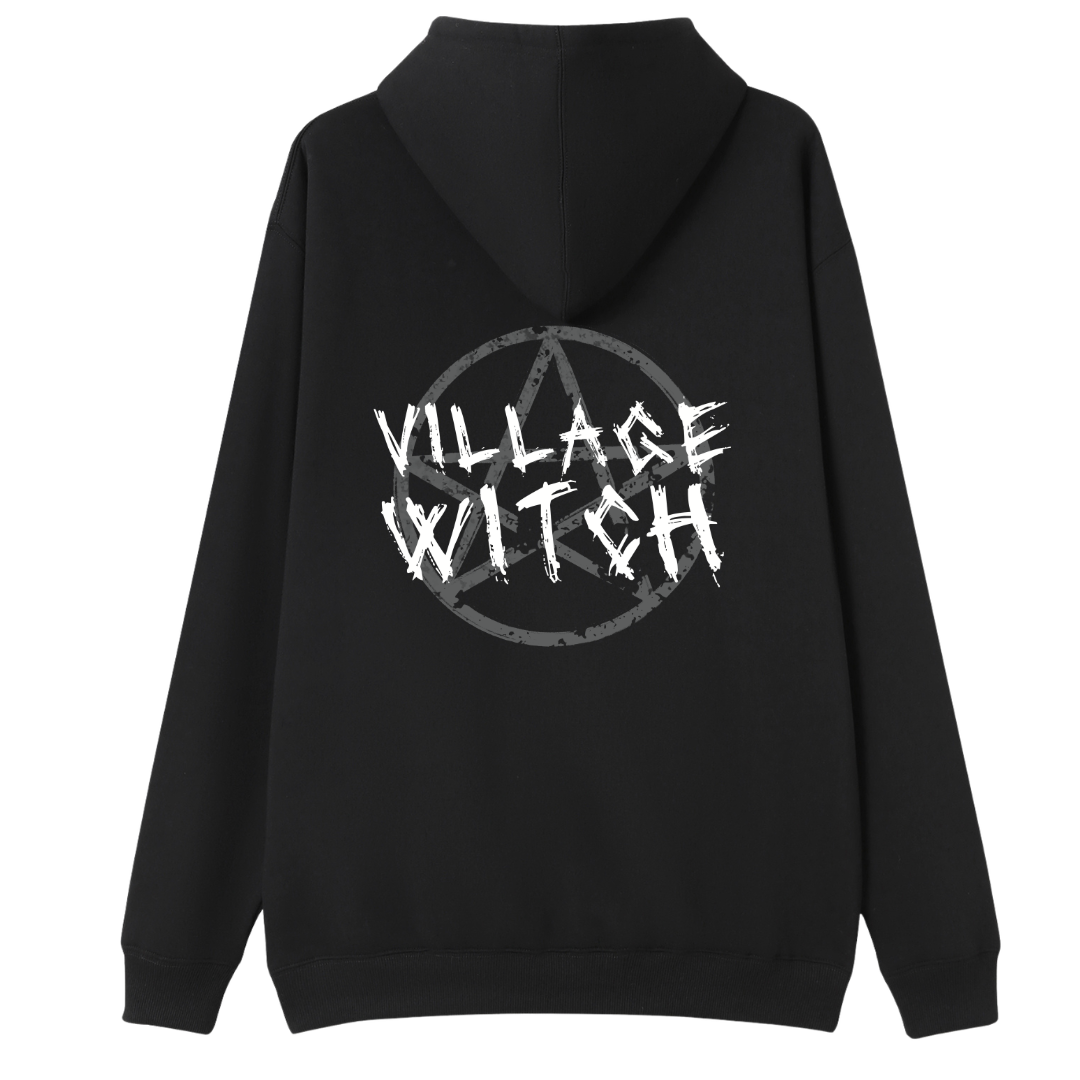A black oversized zip up hoodie shown from the back, with the Village Witch graphic printed large across the back, scratchy lettering over a weathered pentagram.