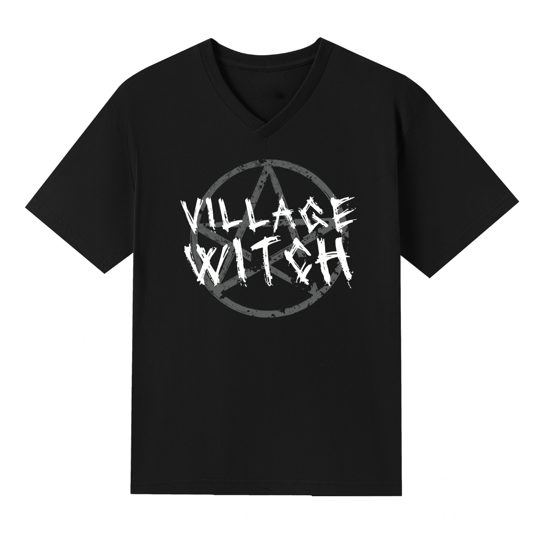A black V neck oversized tee with the Village Witch graphic printed large on the front, scratchy lettering over a weathered pentagram.