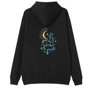 A black oversized hoodie shown from the back, with the Be Magic snake graphic printed large across the back, a blue floral snake with butterflies under a crescent moon.