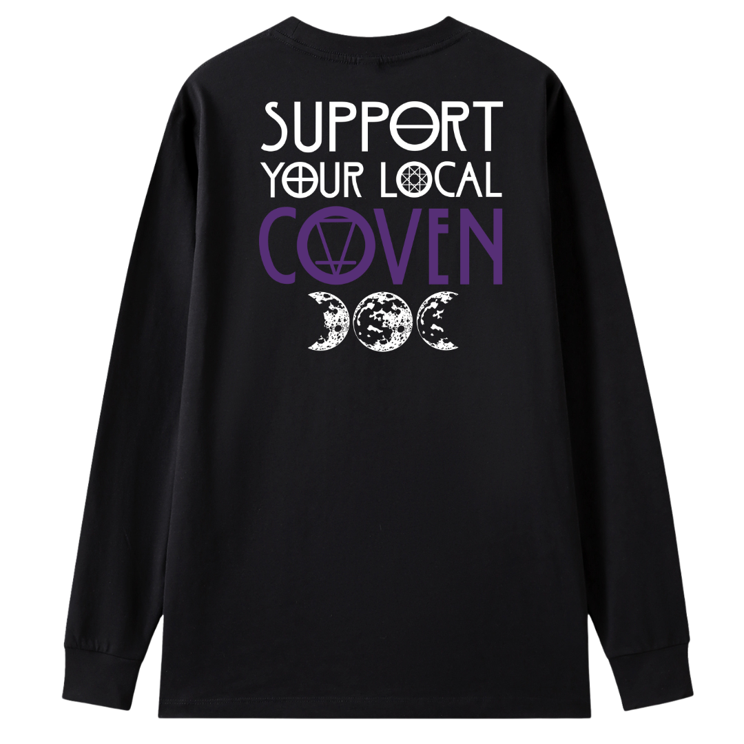 A black long sleeve tee shown from the back, with the Support Your Local Coven graphic printed large across the back, purple lettering above a triple moon.