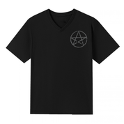 A black V neck oversized tee with a small Village Witch graphic on the left chest.