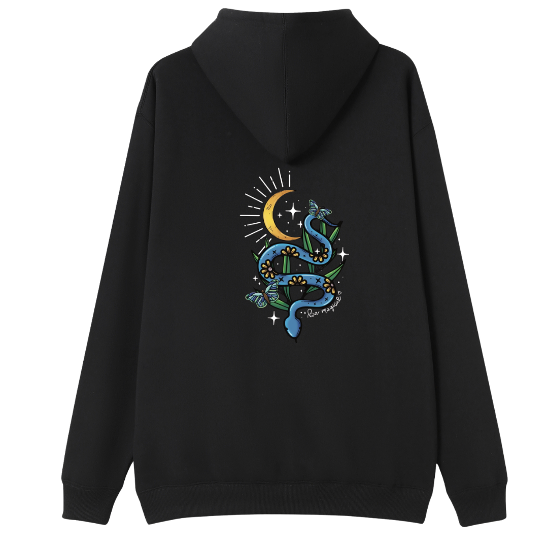 A black oversized zip up hoodie shown from the back, with the Be Magic snake graphic printed large across the back, a blue floral snake with butterflies under a crescent moon.