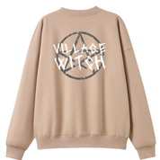 A peach oversized crew neck shown from the back, with the Village Witch graphic printed large across the back, scratchy lettering over a weathered pentagram.