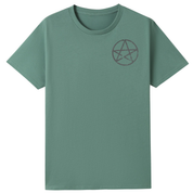 A slate green oversized tee with a small Village Witch graphic on the left chest.