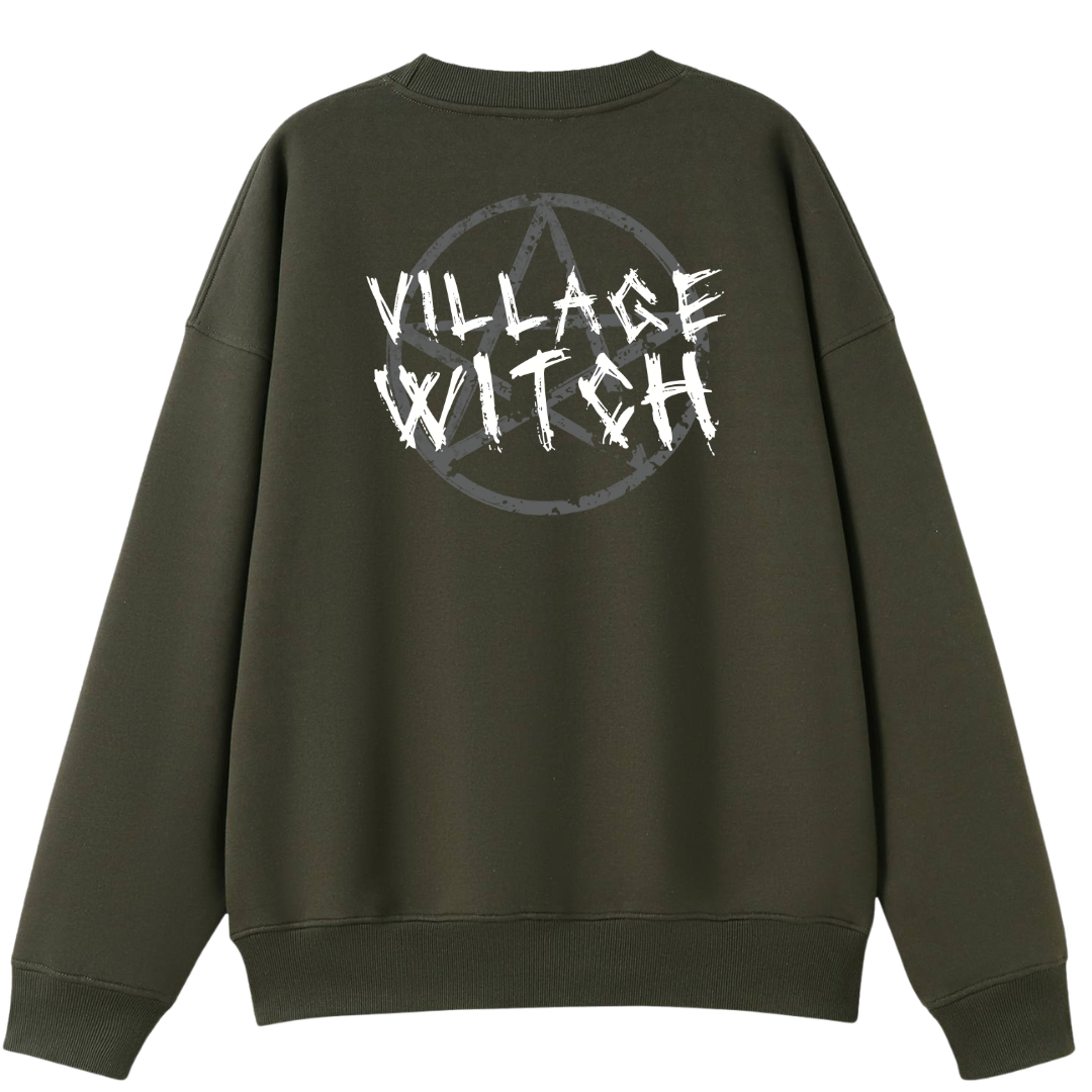 An army green oversized crew neck shown from the back, with the Village Witch graphic printed large across the back, scratchy lettering over a weathered pentagram.