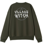 An army green oversized crew neck shown from the back, with the Village Witch graphic printed large across the back, scratchy lettering over a weathered pentagram.