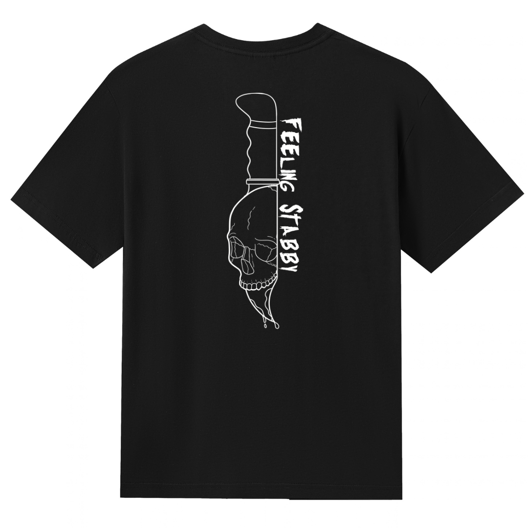 A black V neck oversized tee shown from the back, with the Feeling Stabby graphic printed large across the back, a line drawn skull on a knife blade.
