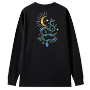 A black long sleeve tee shown from the back, with the Be Magic snake graphic printed large across the back, a blue floral snake with butterflies under a crescent moon.