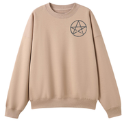 A peach oversized crew neck with a small Village Witch graphic on the left chest.
