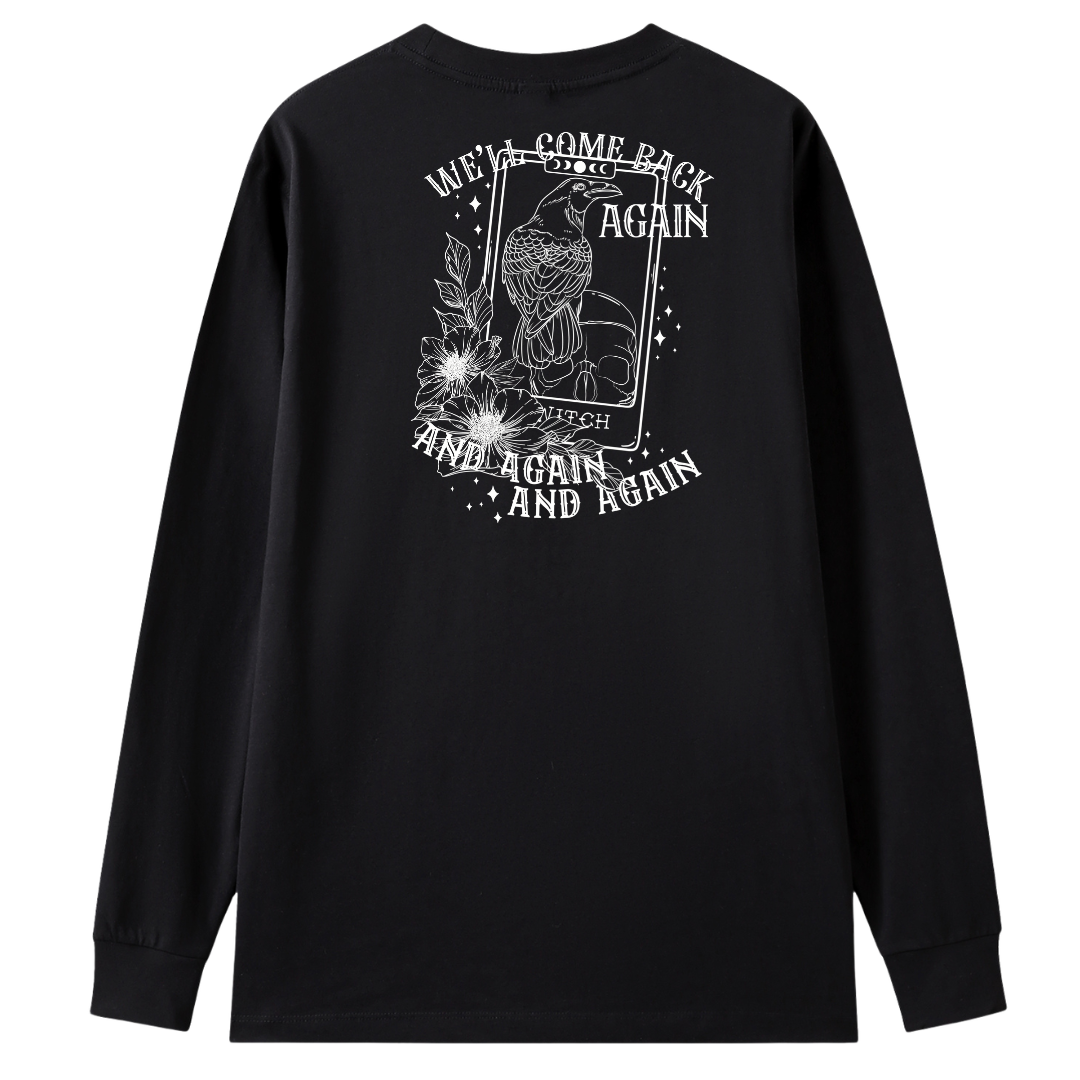 A black long sleeve tee shown from the back, with the We'll Come Back Again graphic printed large across the back, a crow on a tarot card framed by flowers.