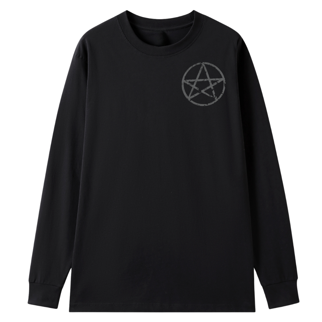 A black long sleeve tee with a small Village Witch graphic on the left chest.