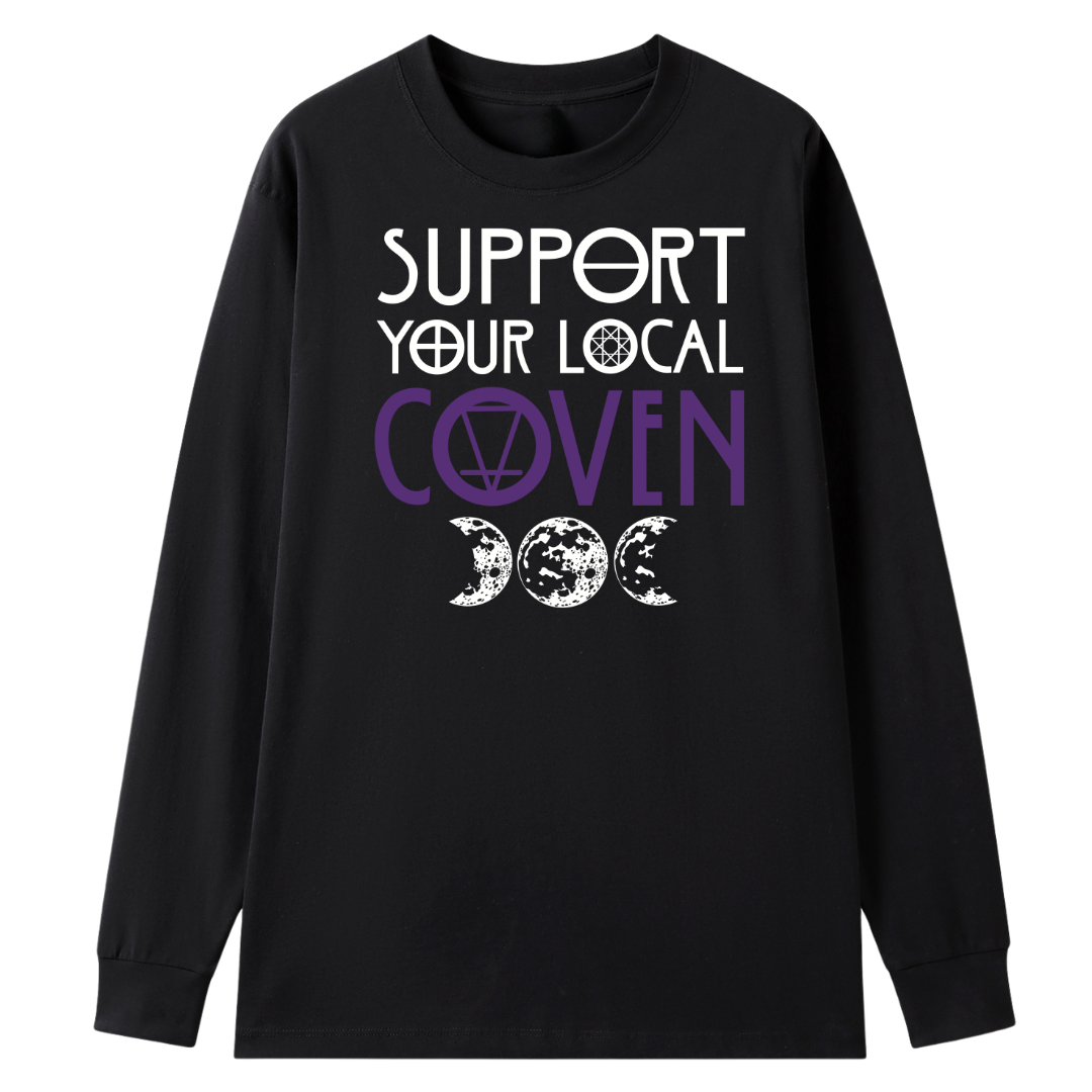 A black long sleeve tee with the Support Your Local Coven graphic printed large on the front, purple lettering above a triple moon.