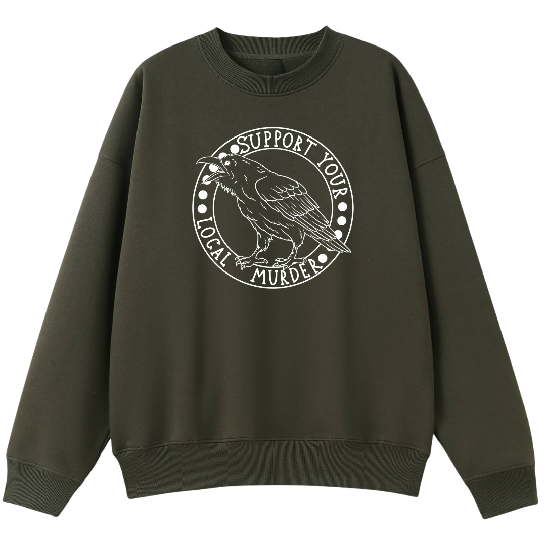 An army green oversized crew neck with the Support Your Local Murder graphic printed large on the front, a crow inside a circular badge.