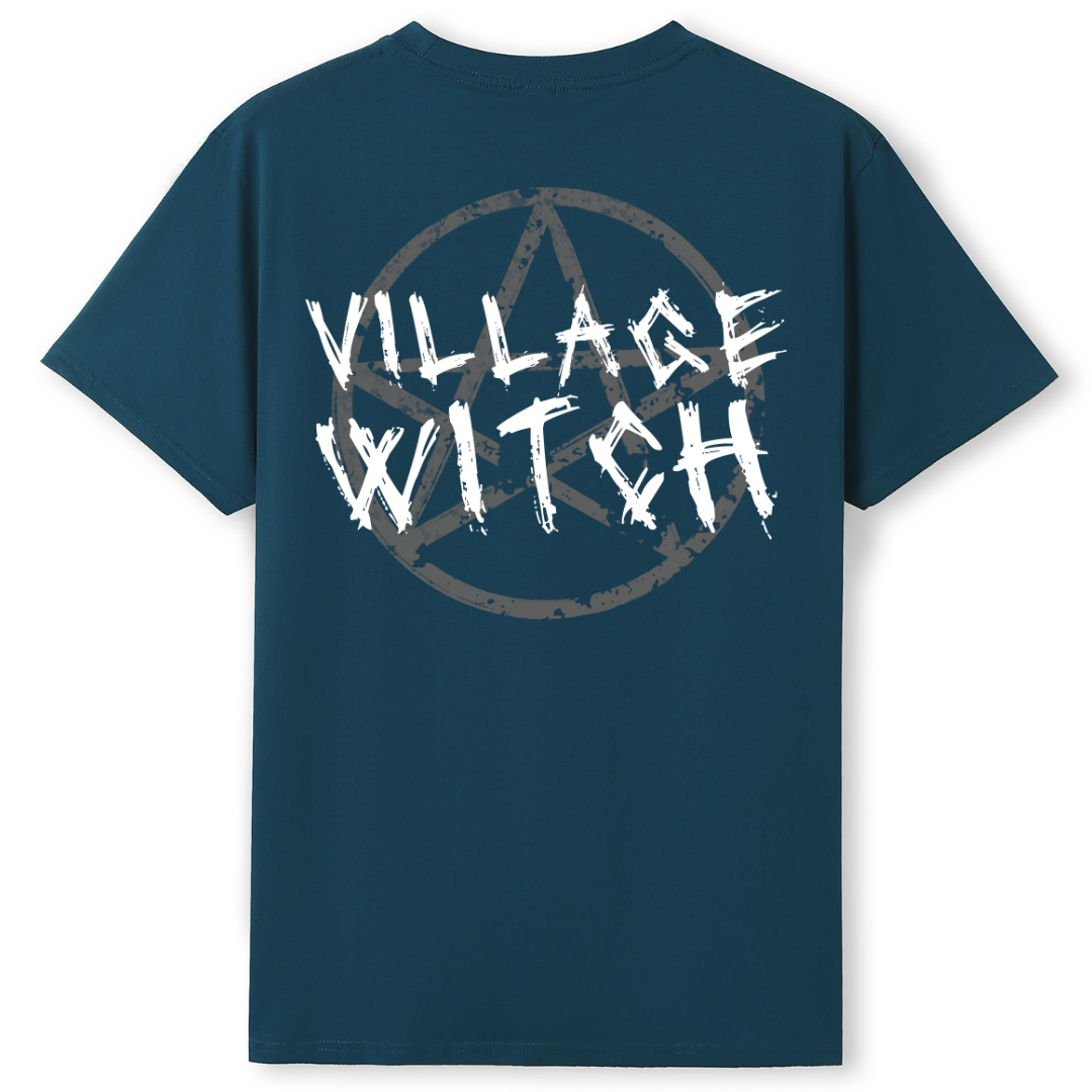A teal oversized tee shown from the back, with the Village Witch graphic printed large across the back, scratchy lettering over a weathered pentagram.
