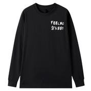 A black long sleeve tee with a small Feeling Stabby graphic on the left chest.