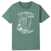 A slate green oversized tee with the We'll Come Back Again graphic printed large on the front, a crow on a tarot card framed by flowers.