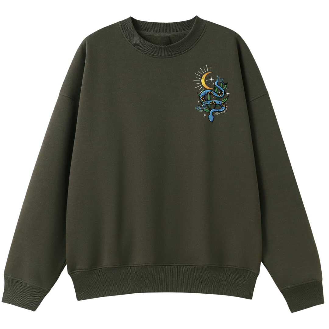 An army green oversized crew neck with a small Be Magic snake graphic on the left chest.