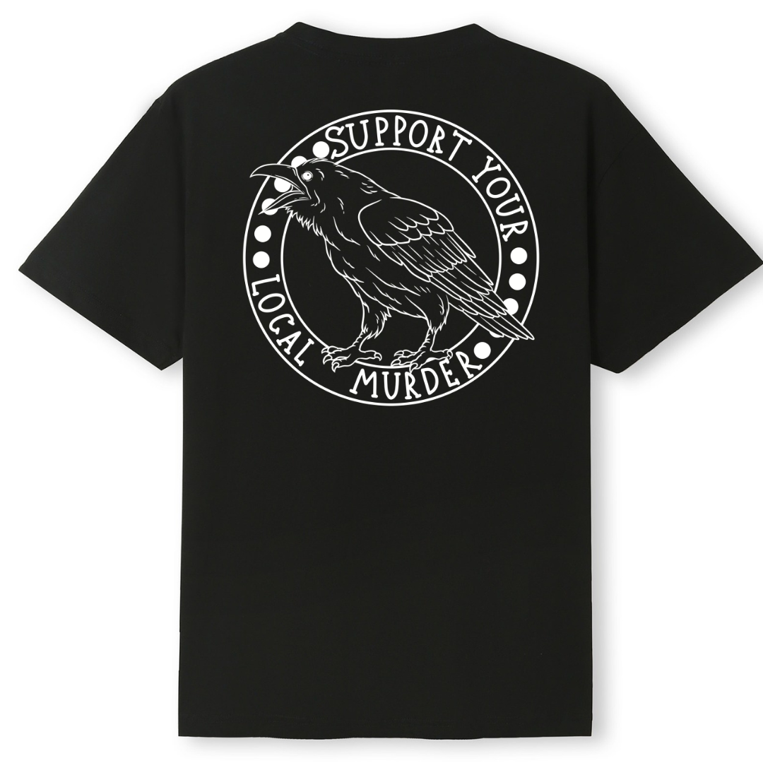 A black oversized tee shown from the back, with the Support Your Local Murder graphic printed large across the back, a crow inside a circular badge.
