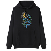 A black oversized hoodie with the Be Magic snake graphic printed large on the front, a blue floral snake with butterflies under a crescent moon.