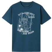 A teal oversized tee with the We'll Come Back Again graphic printed large on the front, a crow on a tarot card framed by flowers.